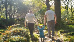 family walking in sunshine